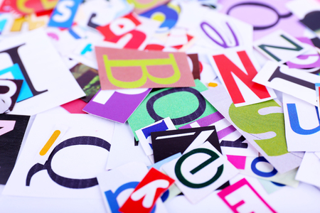 Colorful newspaper letters as backgroundの写真素材