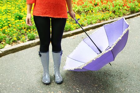 Woman in Boots on rainy autumn day.の写真素材