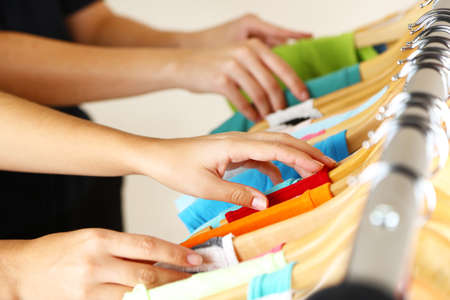 Fashion clothes on shelves in store. Shopping conceptの写真素材