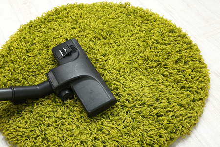 Vacuum cleaner to tidy up carpetの写真素材