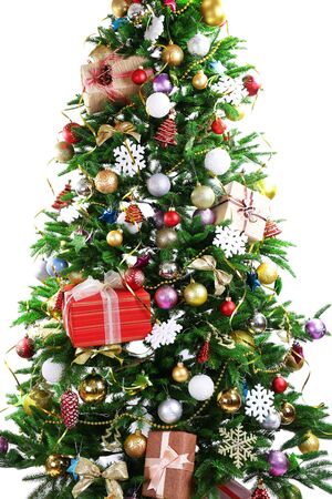 Decorated Christmas tree isolated on whiteの写真素材