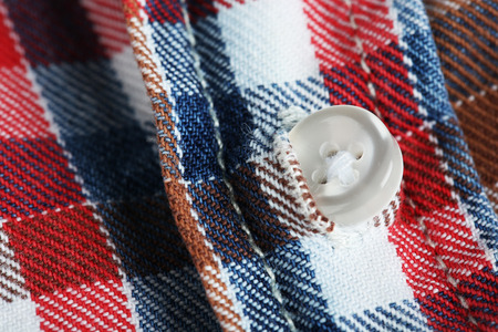Button on clothes close upの写真素材