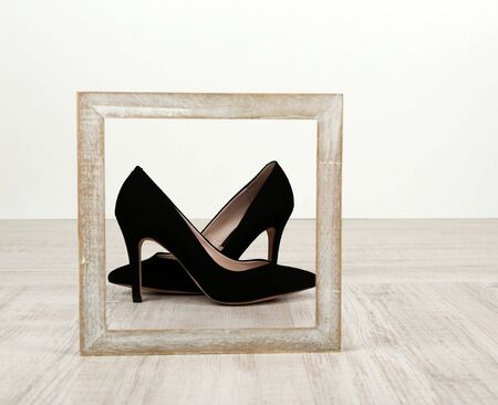 Black women shoes with frame on floorの写真素材
