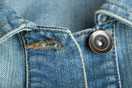 Button on clothes close up