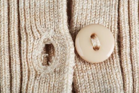 Button on clothes close upの写真素材