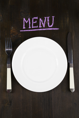 Inscription menu on wooden board close-upの写真素材