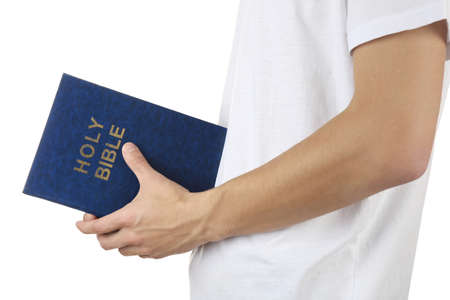 Man holding Bible isolated on white