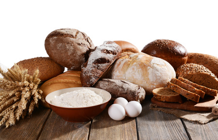 Fresh bread on table on white background