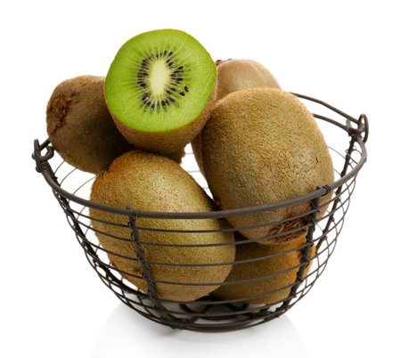 Juicy kiwi in basket isolated on whiteの写真素材