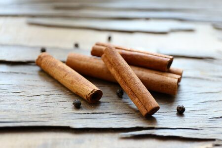 Cinnamon on wooden background, close-upの写真素材