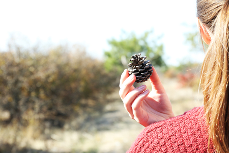 Girl holding cone in hand, outdoorsの写真素材
