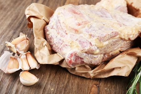 Raw meat on wooden table, close-upの写真素材
