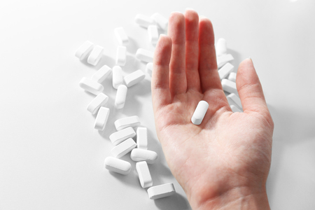 Pills in hand, close-upの写真素材