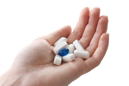 Pills in hand, close-up