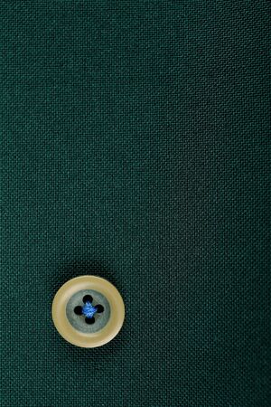 Button on cloth, close up