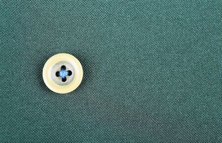 Button on cloth, close upの写真素材