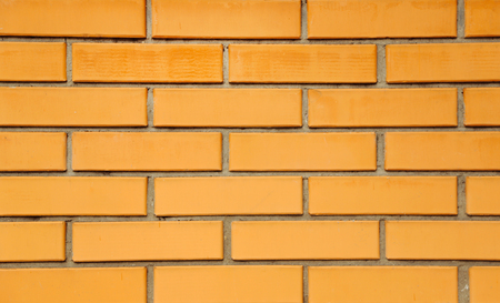 Orange brick wall close-up backgroundの写真素材
