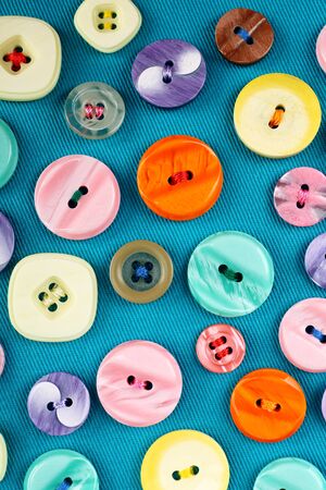 Buttons on blue cloth, close up