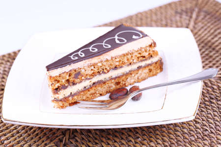 Delicious chocolate cake on plate on table close-up