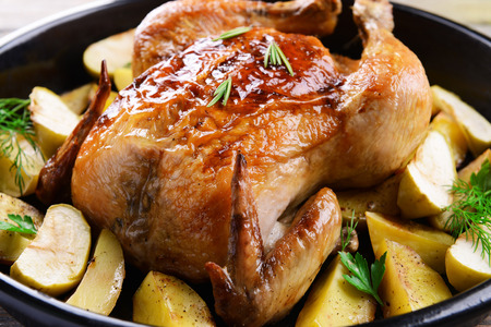 Delicious baked chicken on table close-upの写真素材