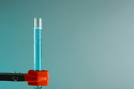 Fixed test tube on support  on light blue backgroundの写真素材