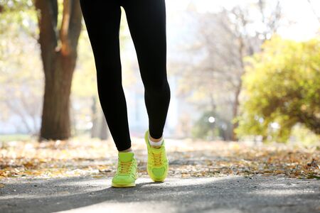 Young woman jogging at parkの写真素材