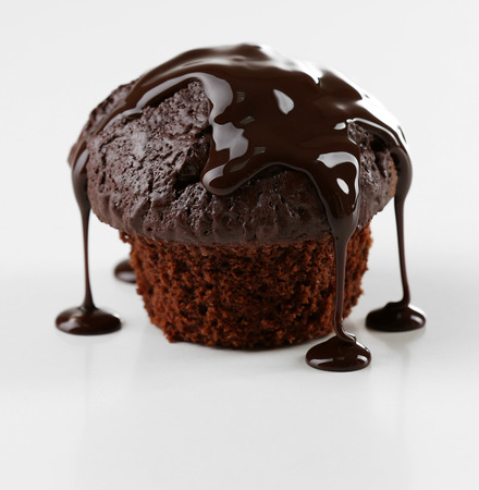 Yummy chocolate cupcake isolated on whiteの写真素材