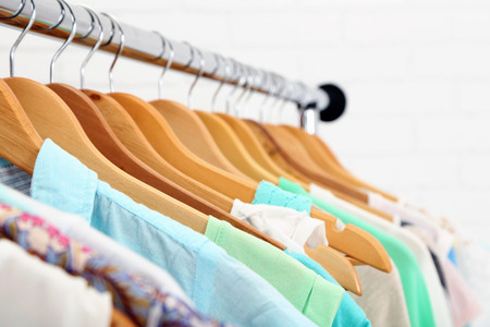 Different clothes on hangers close upの写真素材