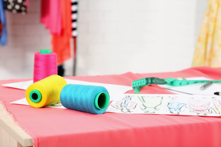 Fashion designer studio with professional equipment, sketches, mannequin, clothの写真素材