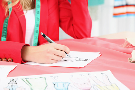 Young fashion designer draws new sketches collectionの写真素材
