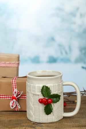 Christmas composition with cup of hot drink, on wooden tableの写真素材