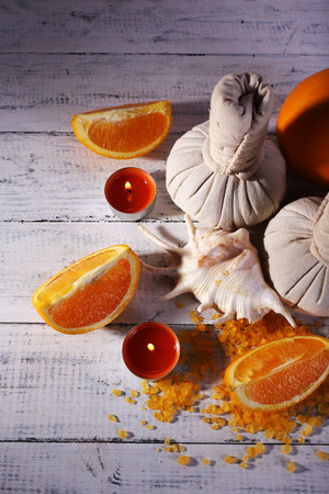 Accessories for massage therapy with candle light on color wooden backgroundの写真素材