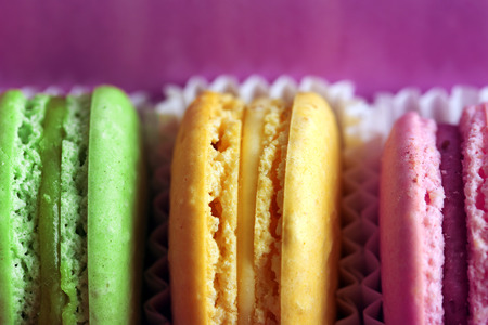 Assortment of gentle colorful macaroons in box, close-up