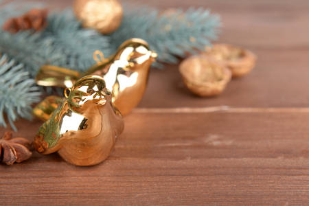 Beautiful Christmas composition with golden birds, on wooden tableの写真素材
