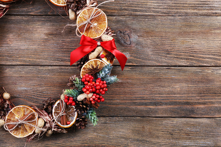 Christmas wreath on rustic wooden backgroundの写真素材
