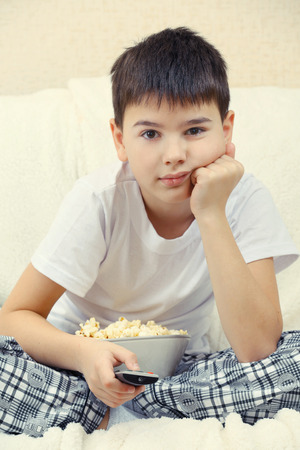 Boy watching TV の写真素材