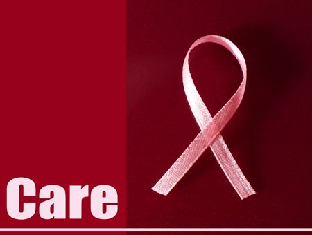 Pink breast cancer ribbon on pink backgroundの写真素材