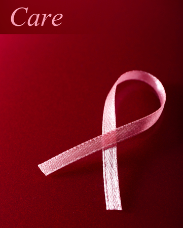 Pink breast cancer ribbon on pink backgroundの写真素材