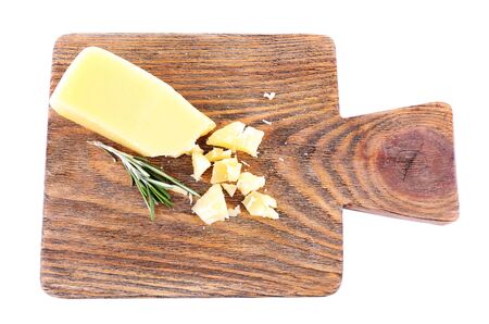Crumbled Parmesan cheese with sprig of rosemary isolated on white