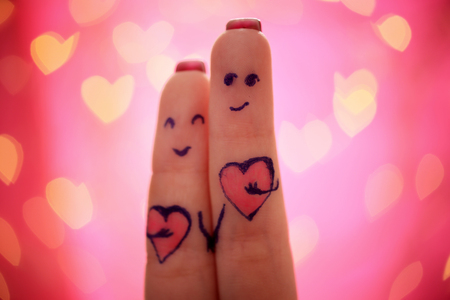 Lovers fingers on pink backgroundの写真素材
