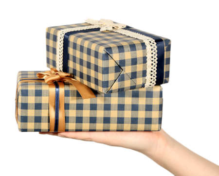 Female hand holding present box with ribbon on light background