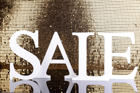 Sale on golden backgroundの写真素材