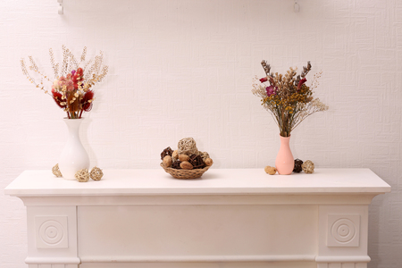 Still life of dried flowers on white wall backgroundの写真素材
