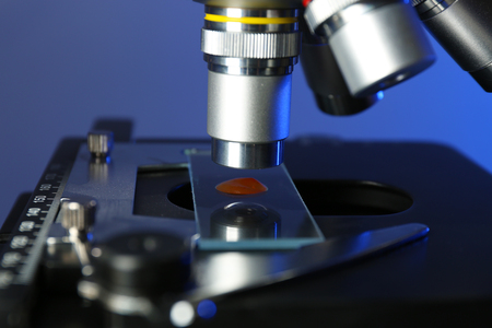 Microscope on color background, close-up