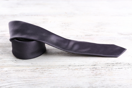 Trendy tie on color wooden backgroundの写真素材