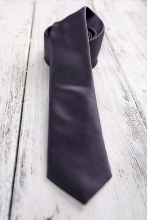 Trendy tie on color wooden backgroundの写真素材
