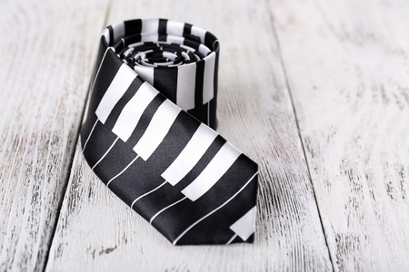 Trendy tie on color wooden backgroundの写真素材