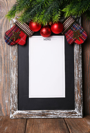 Menu board with Christmas decoration on wooden planks backgroundの写真素材