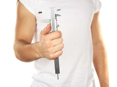 Adjustable wrench in male hand isolated on white