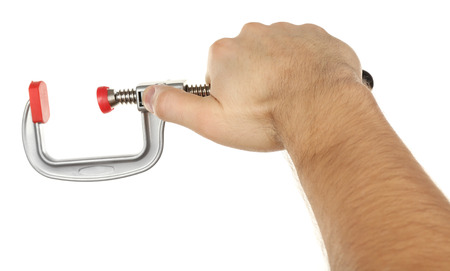 Clamp tool in male hand isolated on whiteの写真素材